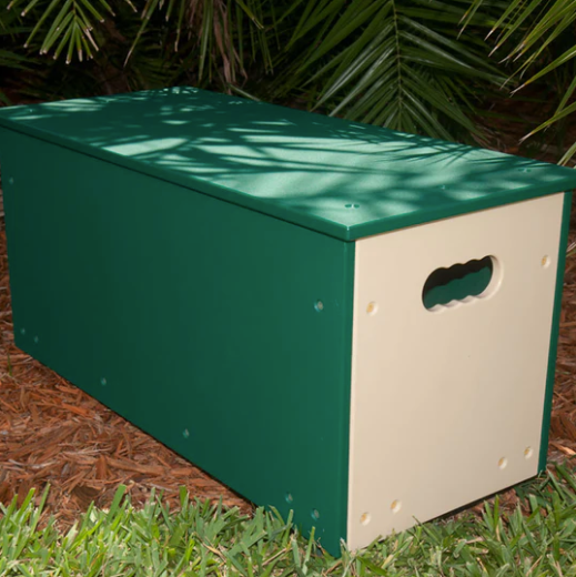 Rectangular green and beige durable storage box with handle cutout, suitable for indoor and outdoor play and seating.