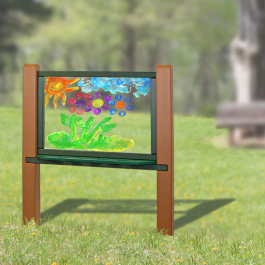 Recycled plastic art easel with clear double-sided panel featuring colorful painted sun, clouds, and flowers outdoors