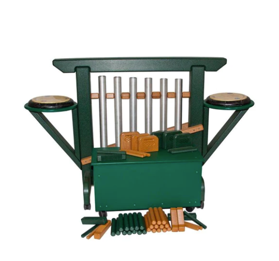 Green and cedar outdoor musical chime unit with metal chimes, side drums, percussion accessories, storage bench, and casters