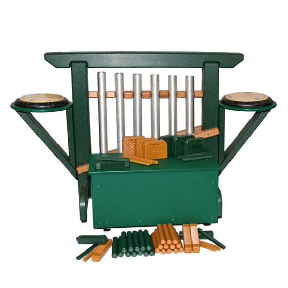 Green and cedar outdoor musical chime unit with metal chimes, drums, wooden percussion instruments, and storage bench