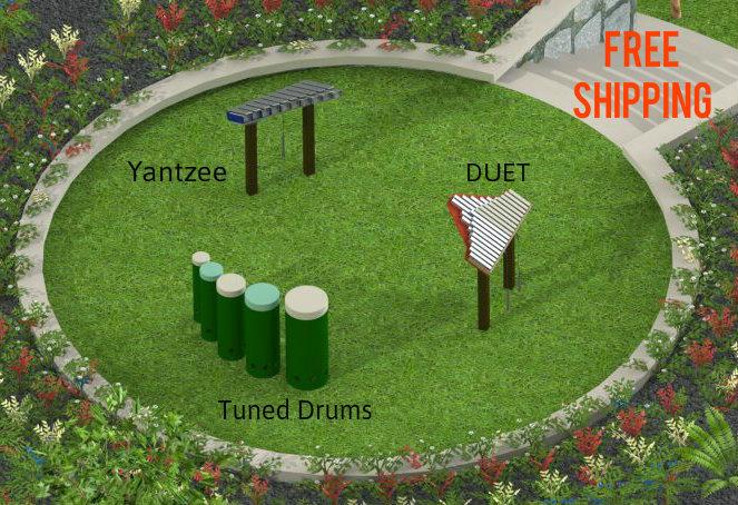 Overhead view of outdoor musical park instruments including tuned drums, metal chimes, and xylophone-style bars on grass