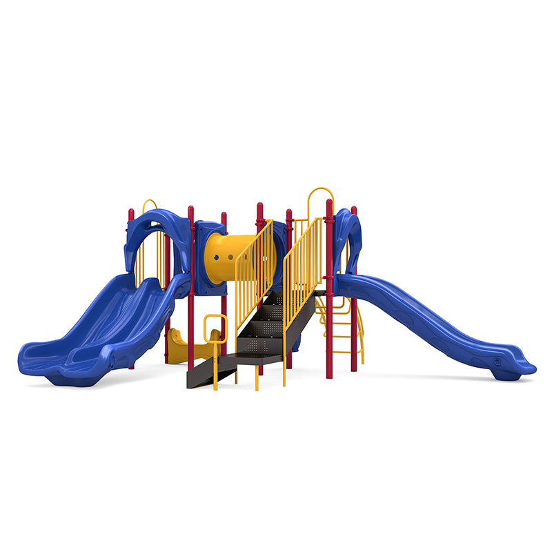 Colorful playground structure with double and single blue slides, yellow climbing tunnel, stairs, and red support posts.