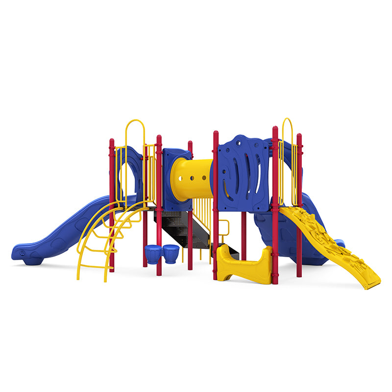 Colorful playground structure with blue double and single slides, yellow climbing wall, crawl tunnel, bongo drums, and red supports