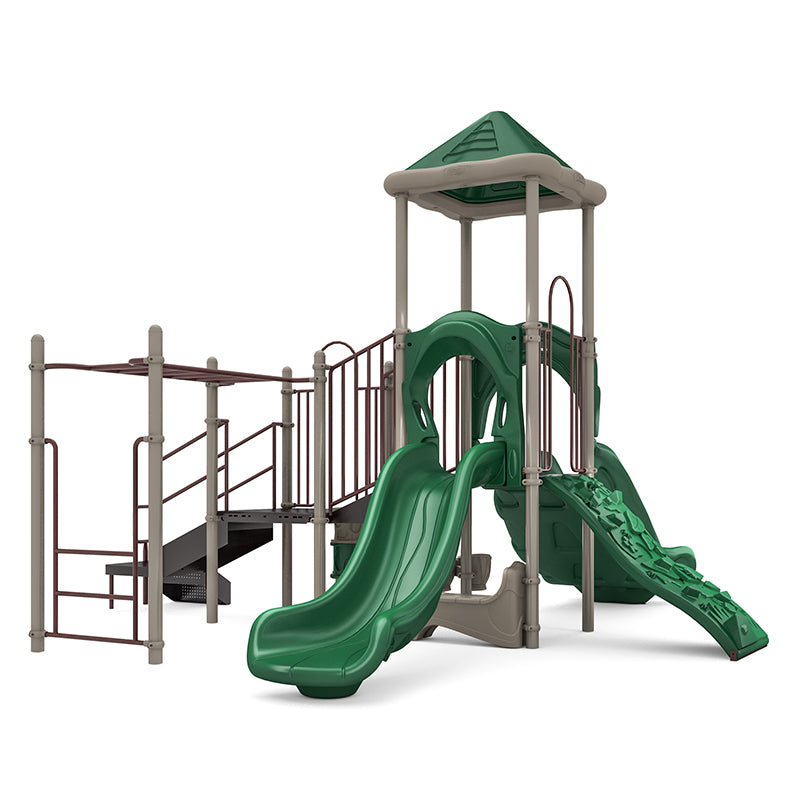 Green and beige playground structure with single and double slides, climbing wall, monkey bars, overhead ladder, and musical bongos on shaded platform
