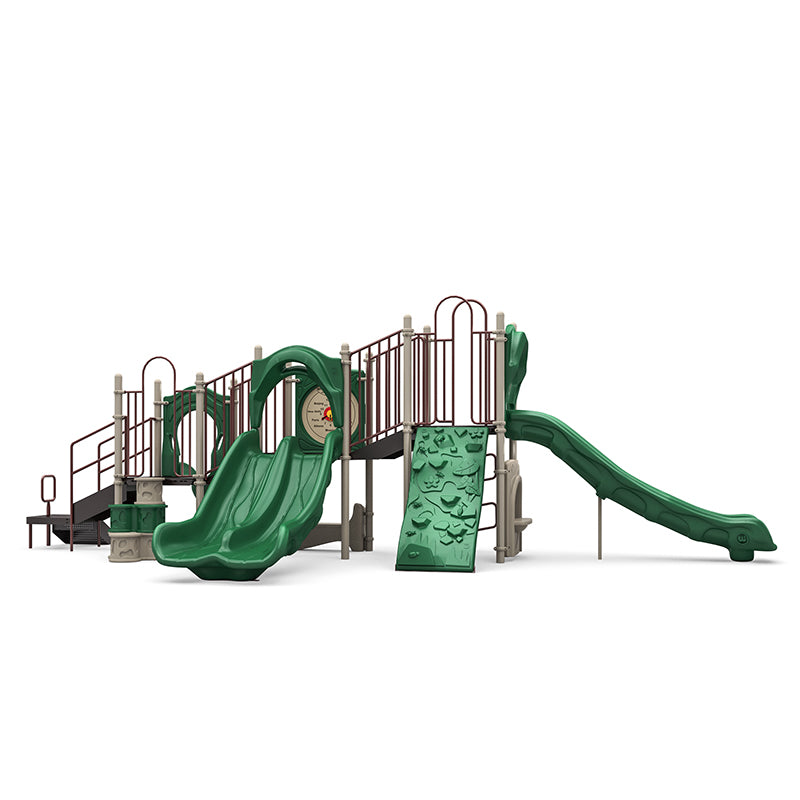 Outdoor playground structure with double and single slides, climbing wall, stairs, and interactive panels in green and beige colors