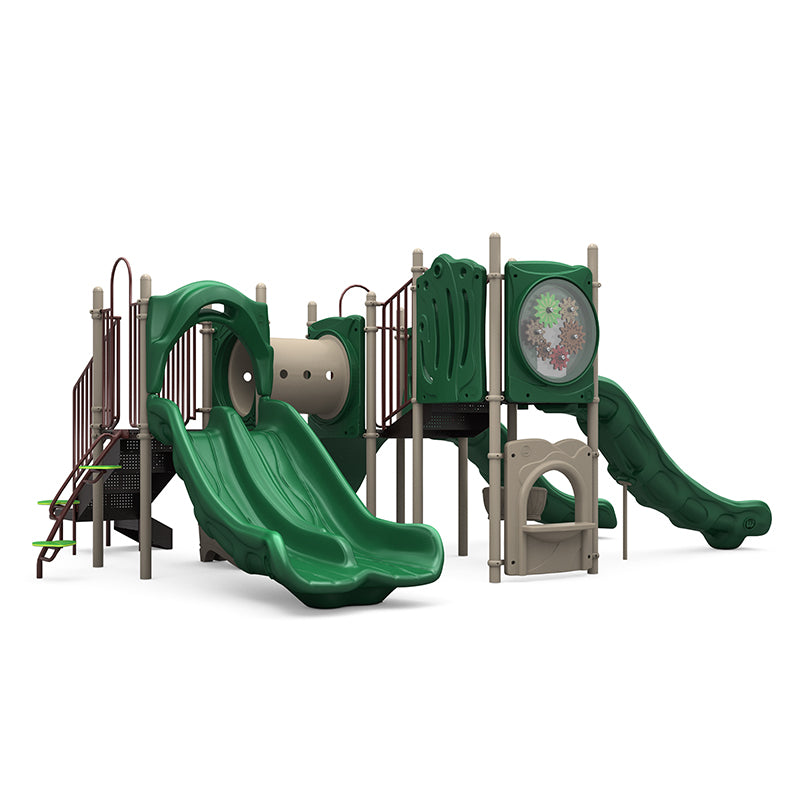 Green and beige playground structure with double and single slides, crawl tunnel, climbing panels, and interactive gear panel