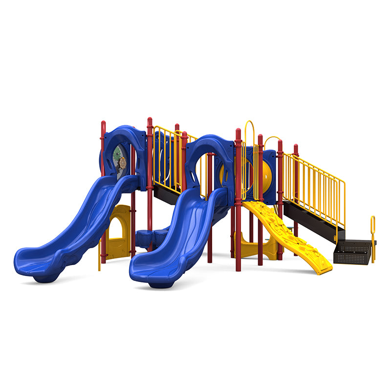 Colorful playground structure with double and single blue slides, yellow climbing wall, crawl tunnel, and interactive gear panels.