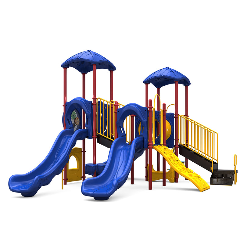 Colorful playground structure with blue double slides, yellow climbing wall, crawl tunnel, and blue leaf-shaped roofs