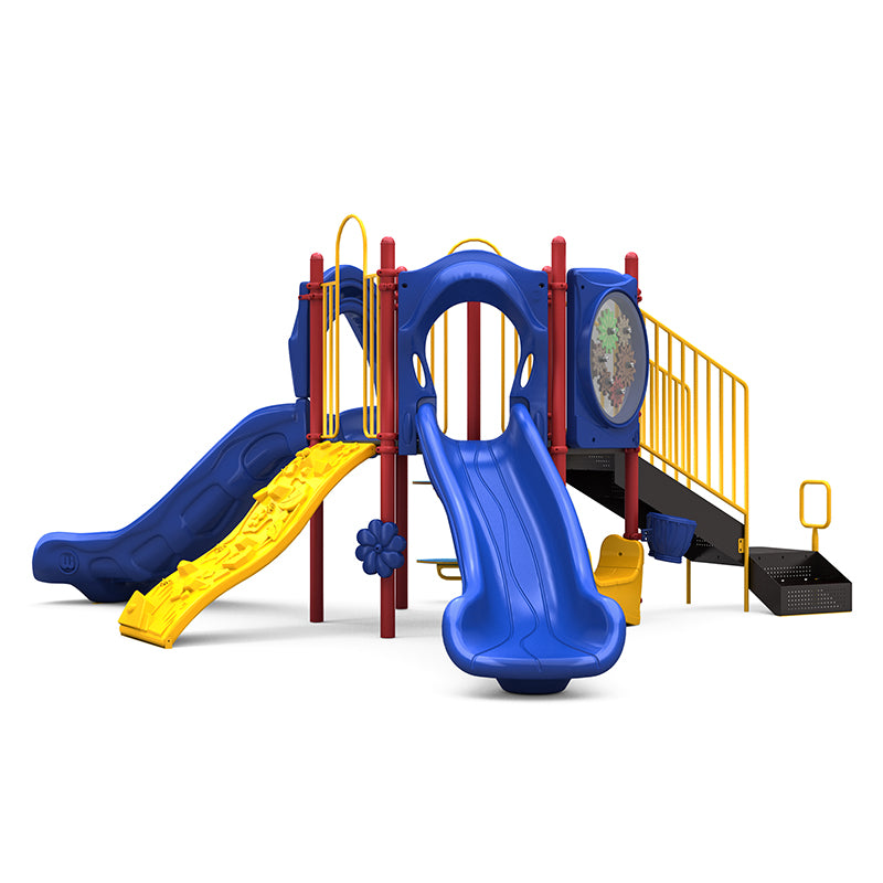 Colorful playground structure with double and single blue slides, yellow climbing wall, stairs, and interactive play panels including gears and musical elements.