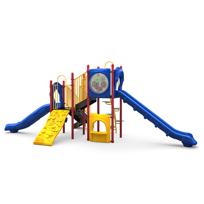 Colorful playground structure with blue slides, yellow climbing wall, red posts, gear panel, and musical drum elements.