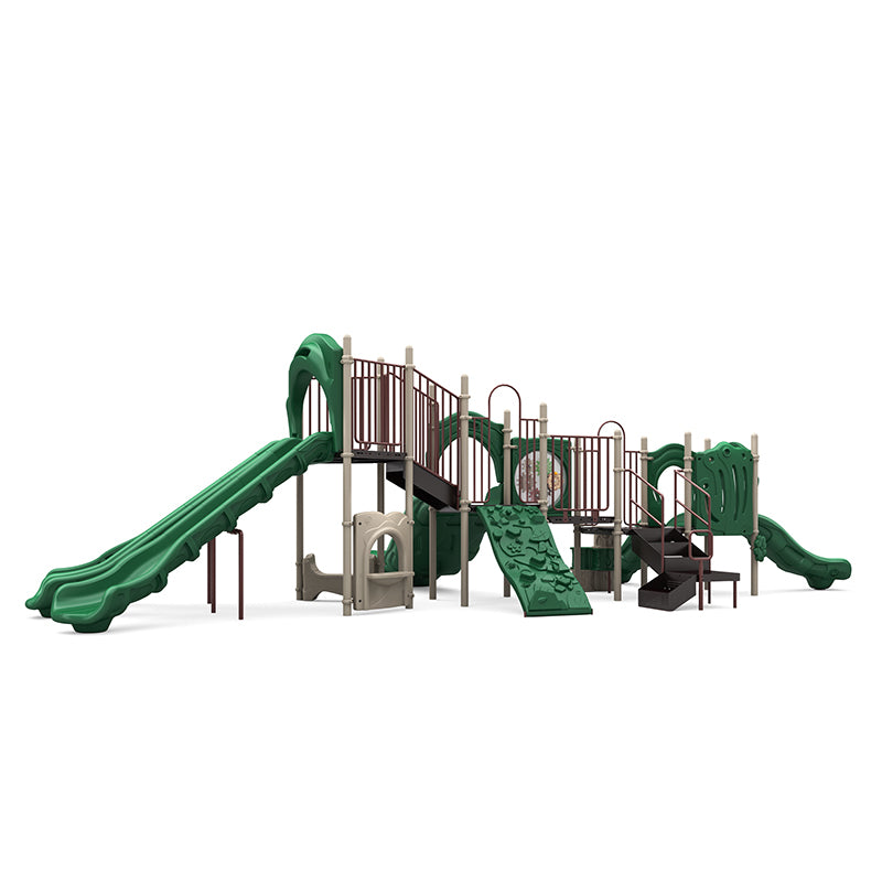 Green and tan outdoor commercial playground with triple and curved slides, rock climber, tunnel, and activity panels.