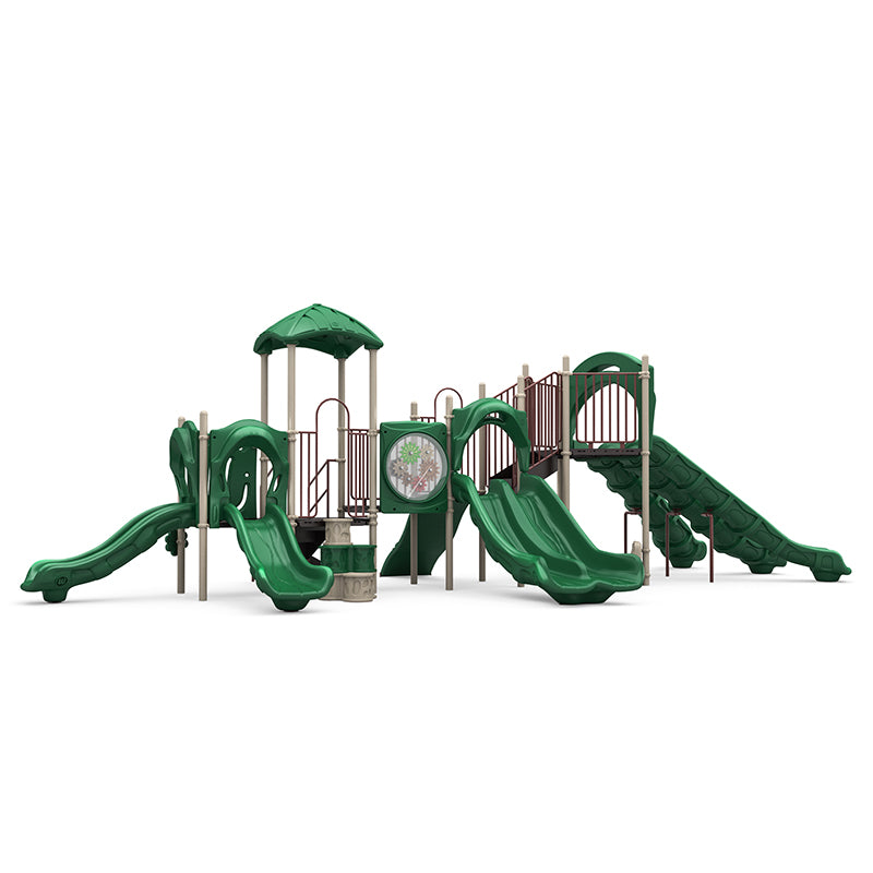 Green commercial playground with triple, double, single slides; rock wall climber, gear panel, canopy roof; studio view