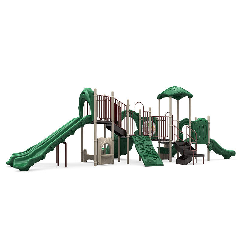 Outdoor commercial playground with double wave slide, curved single slide, rock climber, gear panel, and leaf-canopy roofs