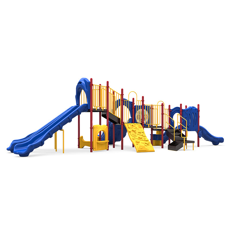 Large outdoor commercial playground with double and single slides, yellow rock climber, stairs, and interactive panels