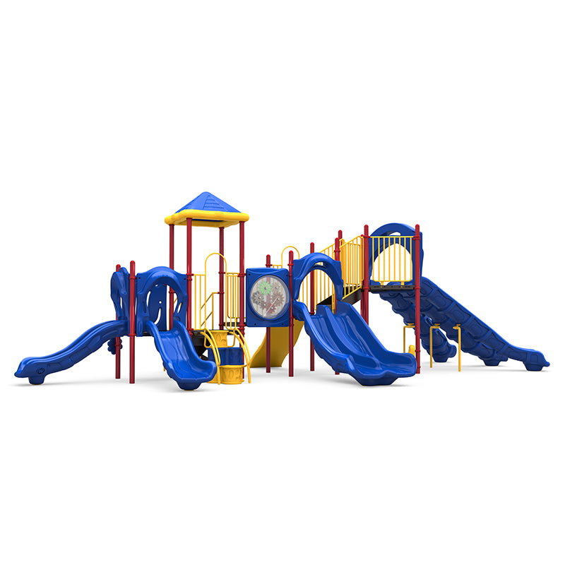 Commercial playground structure with blue triple/double/single slides, rock climber, gear panel, yellow rails on red posts.