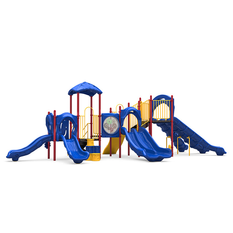 Commercial outdoor playground with blue double and curved slides, climbing wall, activity panel, yellow rails, red posts.