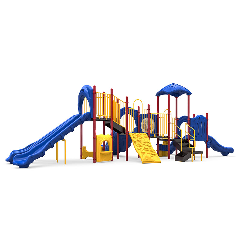 Large playground with blue triple and curved slides, yellow rock wall, activity panel, and shade canopy
