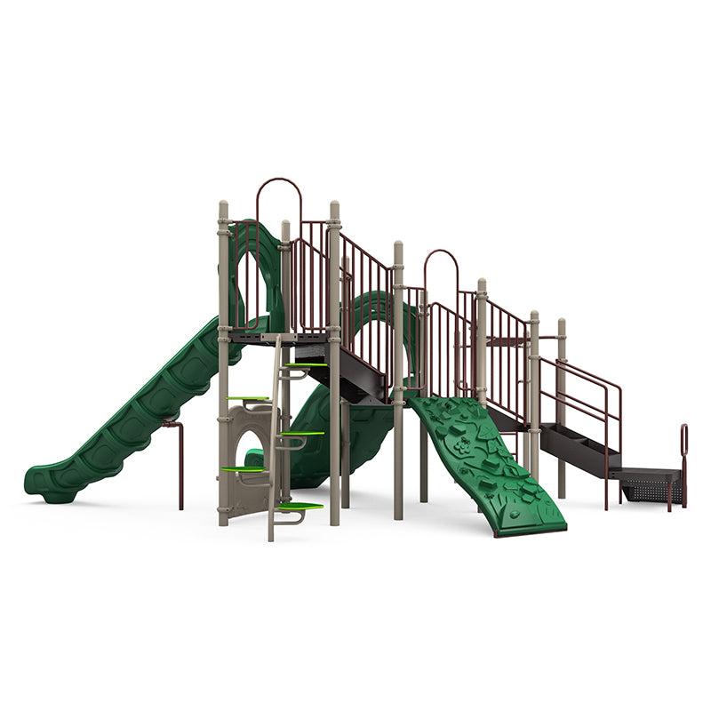 Commercial playground structure with dual slides, rock-climbing wall, leaf step climber, ladders, elevated platforms, and interactive panels.