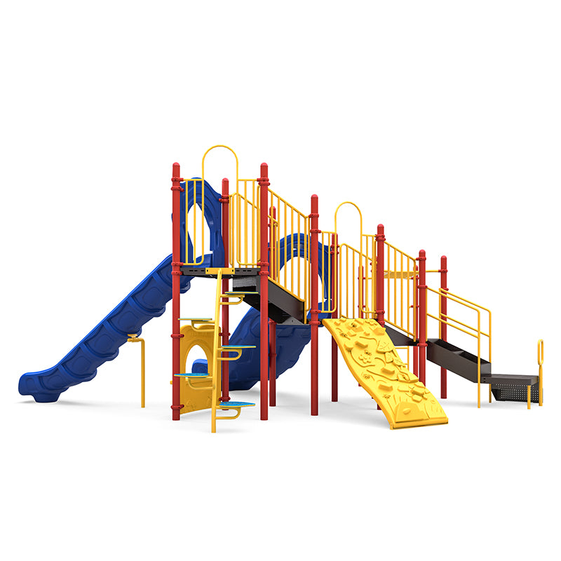 Commercial playground structure with dual blue slides, yellow rock climbing wall, leaf step climber, ladders, and yellow safety rails.