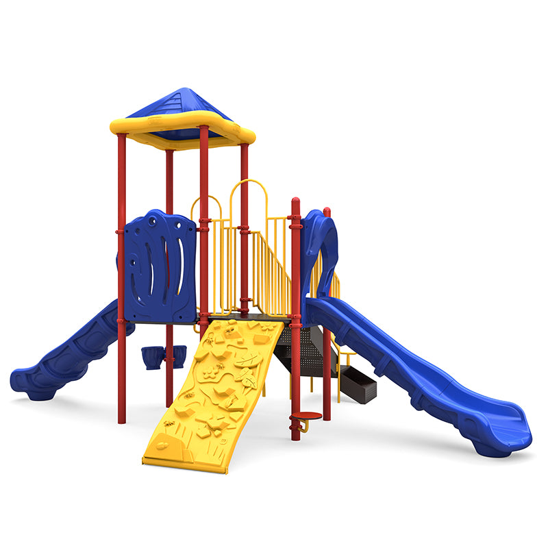 Colorful playground structure with blue slides, yellow climbing wall, red posts, and blue pyramid roof