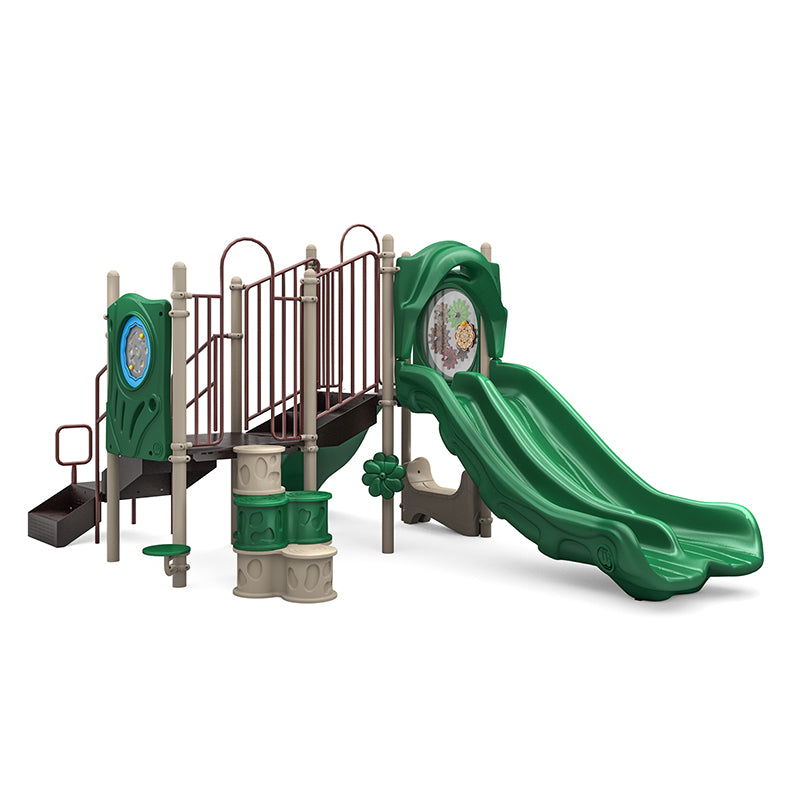 Sunny Stack Playground with double green slides, climbing elements, gears panel, rain wheel, maze panel, and saddle seat in neutral tones