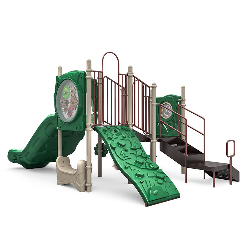 Compact playground structure with green climbing ramp, double slide, stairs, interactive gear panels, rain wheel, and maze panel.