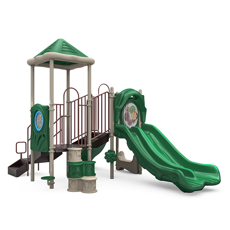 Green and beige playground structure with double slide, climbing elements, interactive gear panel, and pyramid roof