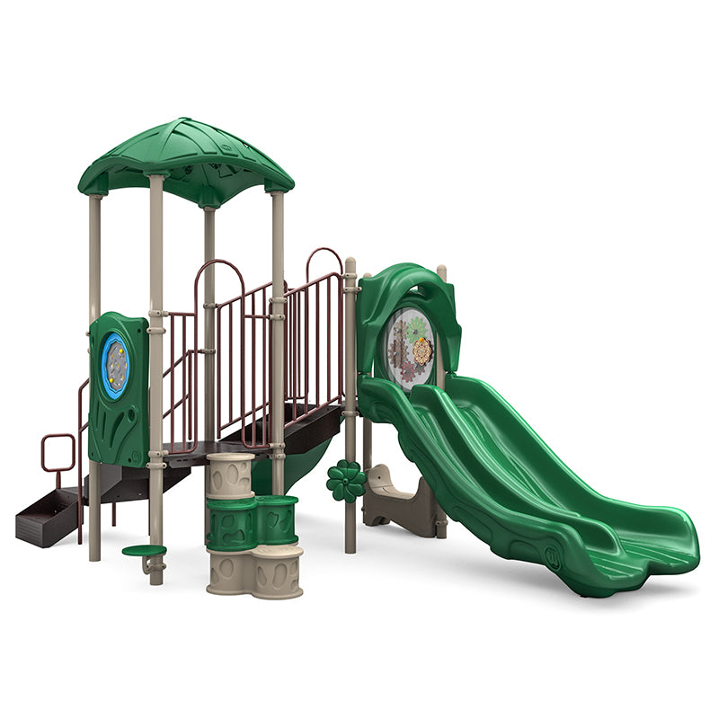 Green and beige playground structure with double slide, climbing elements, interactive gear panel, maze, and leaf-shaped roof
