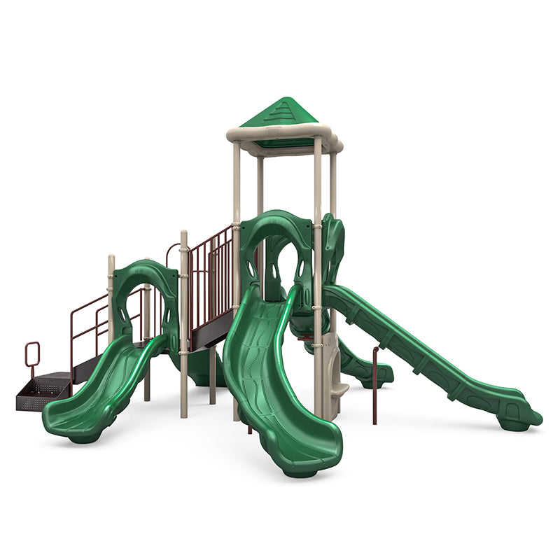 Green and beige playground structure with four slides, rock climbing wall, musical bongos, and shaded platform