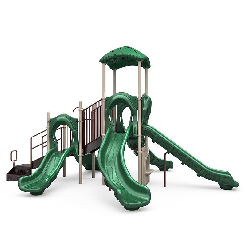 Green and beige playground structure with four slides, rock climbing wall, musical bongos, and shaded platform