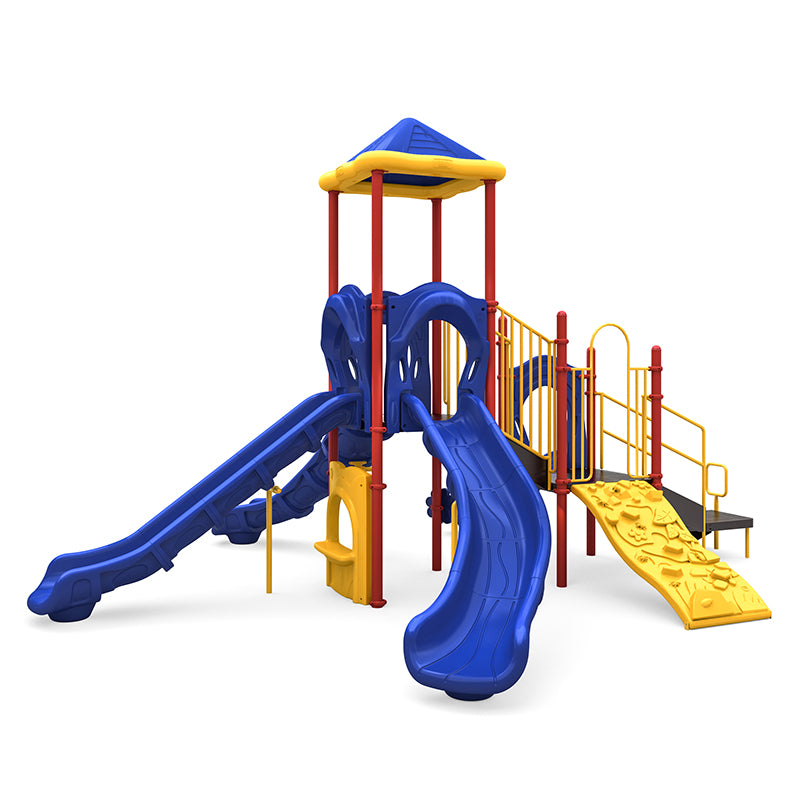 Colorful playground structure with blue slides, yellow climbing wall, red support poles, and a blue pyramid roof.