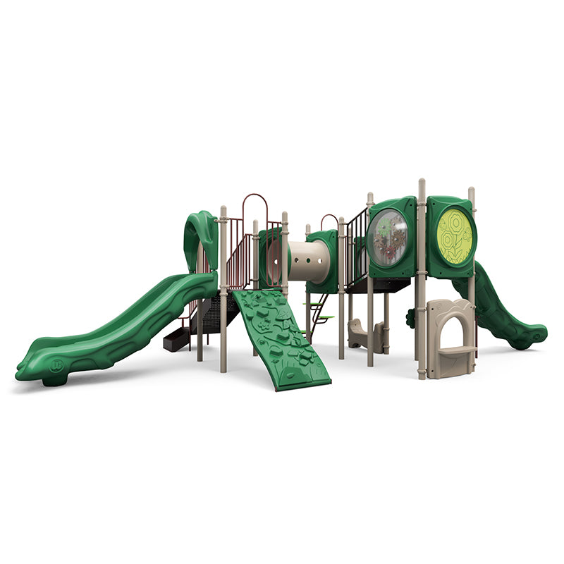Neutral-toned playground structure with green slides, climbing wall, tunnel, interactive gear and panel features