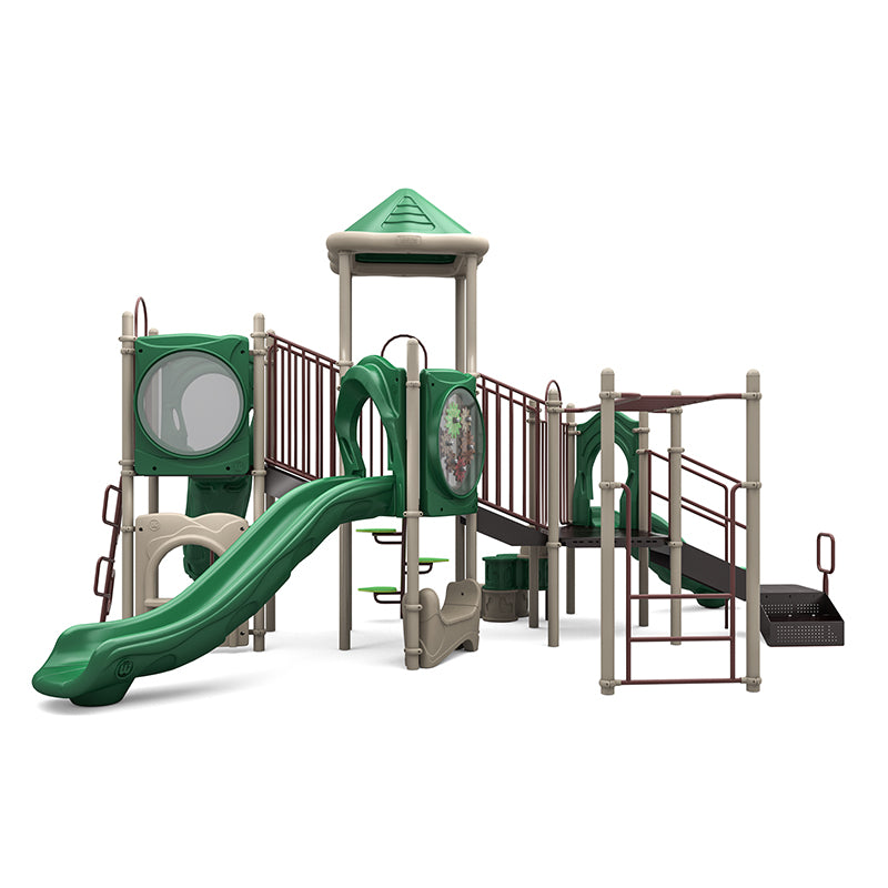 Outdoor playground structure with green slides, climbing ladders, interactive gear panel, and elevated platforms