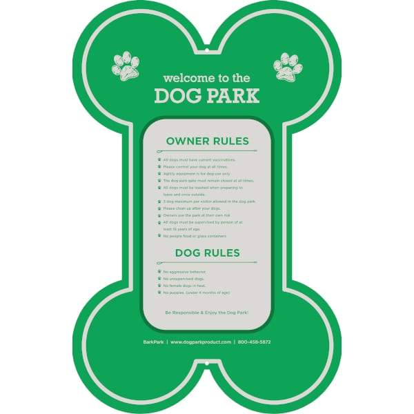 Green dog-bone shaped dog park welcome sign with white text listing park rules and recommendations, mounted on a sturdy post