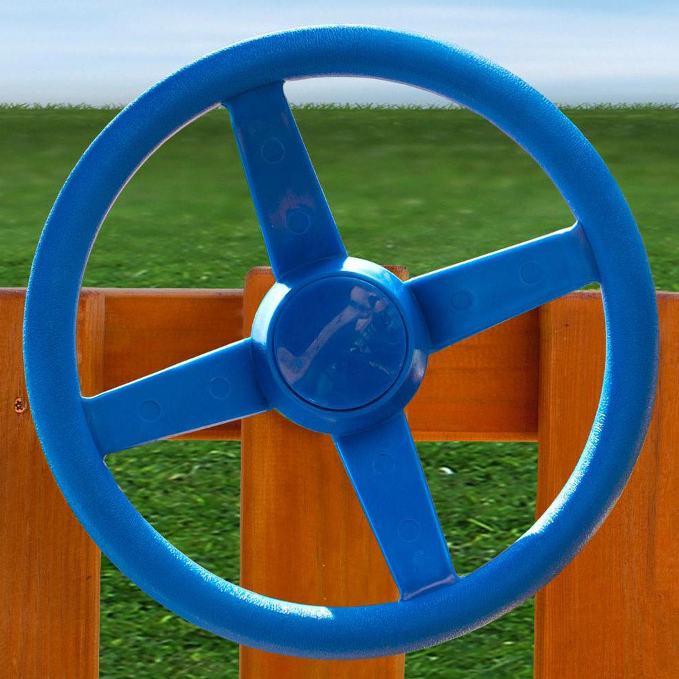 Blue plastic steering wheel mounted on wooden playset railing, outdoor playground accessory