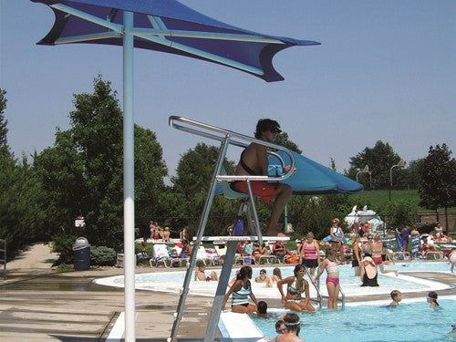 Blue lifeguard shade canopy over elevated chair at busy outdoor pool with swimmers and sunbathers
