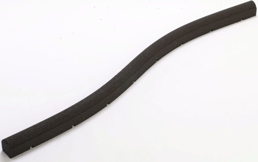 Flexible black rubber playground border timber with rounded top and drainage ports, curved to form a smooth edge