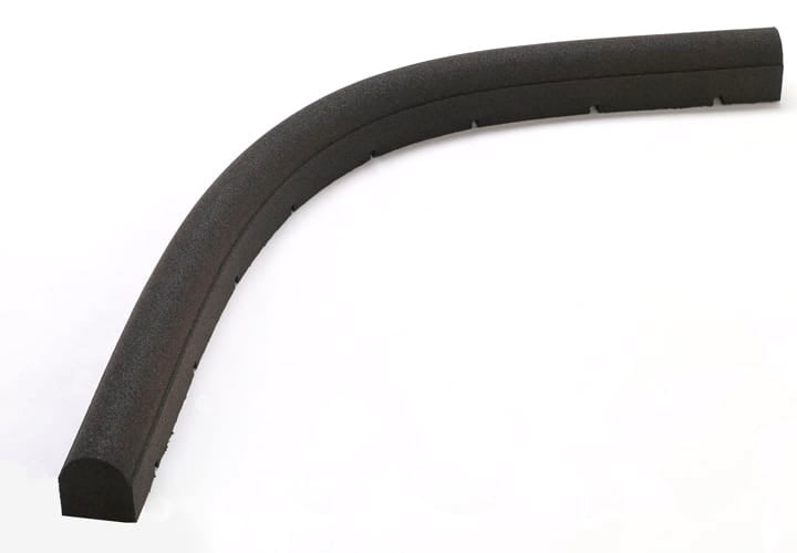 Flexible black rubber playground border timber with rounded top and drainage ports for landscaping edges
