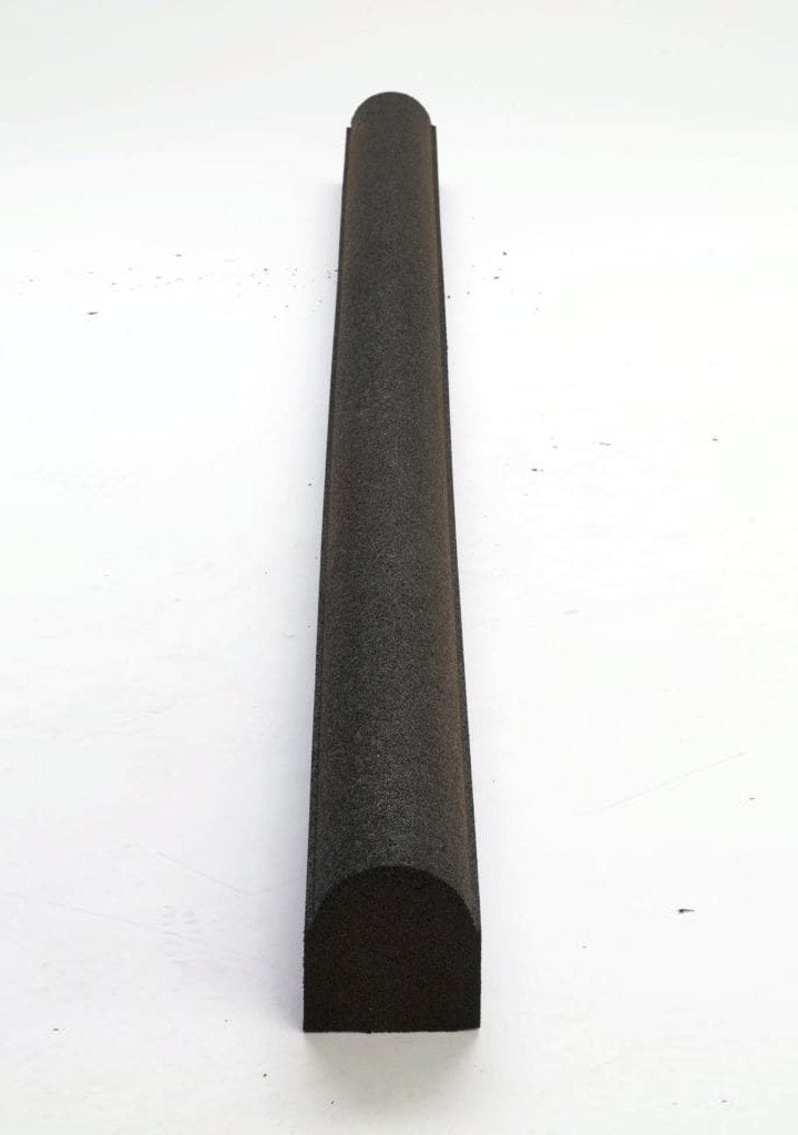 Overhead view of black rounded top rubber playground border timber with textured surface