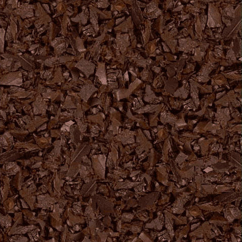 Dark brown recycled rubber mulch pieces with textured, irregular shapes for playground surfacing and shock absorption