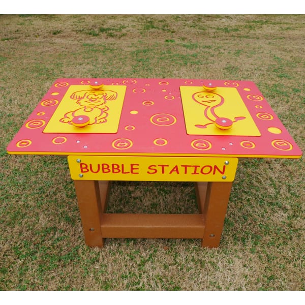 Outdoor bubble play station with colorful red and yellow panels featuring playful cartoon characters on a sturdy wooden frame