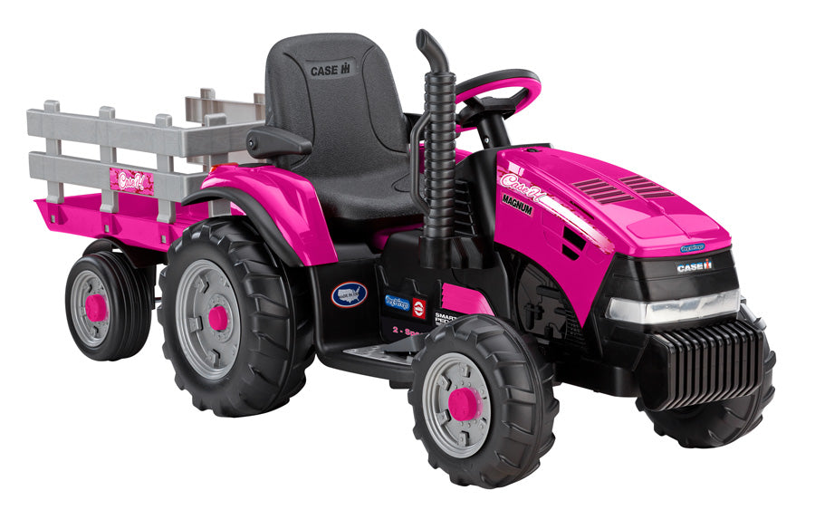Pink ride-on toy tractor with large detachable stake-side trailer, black seat, and rugged farm-style wheels
