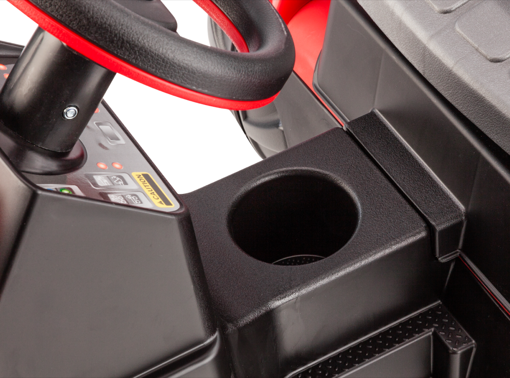 Black and red pedal ride-on tractor steering wheel with built-in cup holder on dashboard