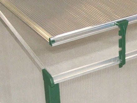 Green-framed double cold frame greenhouse corner with twin wall polycarbonate panels and adjustable roof windows