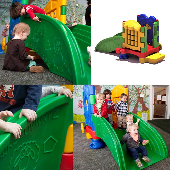Colorful toddler slide with embossed animal, shape, alphabet, and number figures on green sides promoting early development