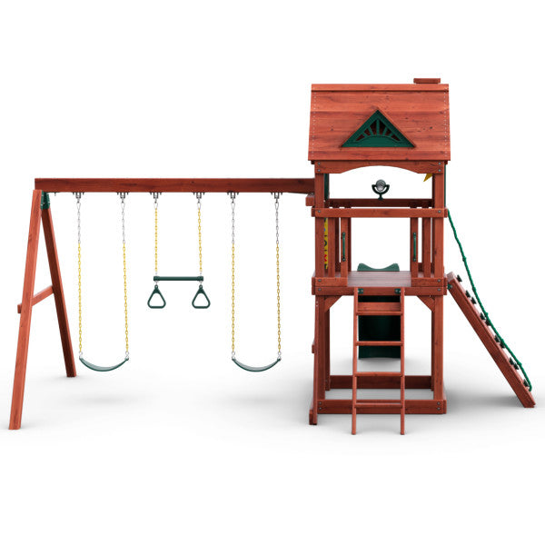 Redwood-finished wooden swing set with two belt swings, trapeze bar, climbing wall, and upper clubhouse with wood roof and chimney