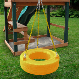 Bright yellow enclosed plastic tire swing with 360° swivel and coated chains hanging from wooden playset in grassy yard