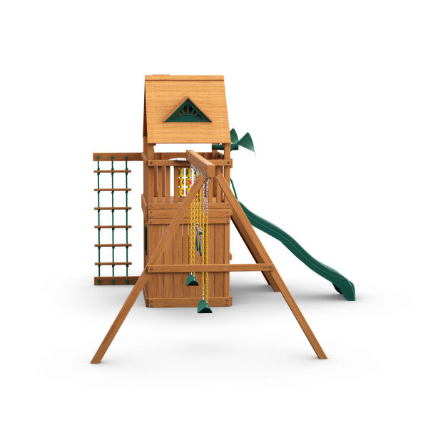 Wooden playset with amber finish featuring clubhouse, green slide, two belt swings, climbing rope ladder, and tic-tac-toe panel