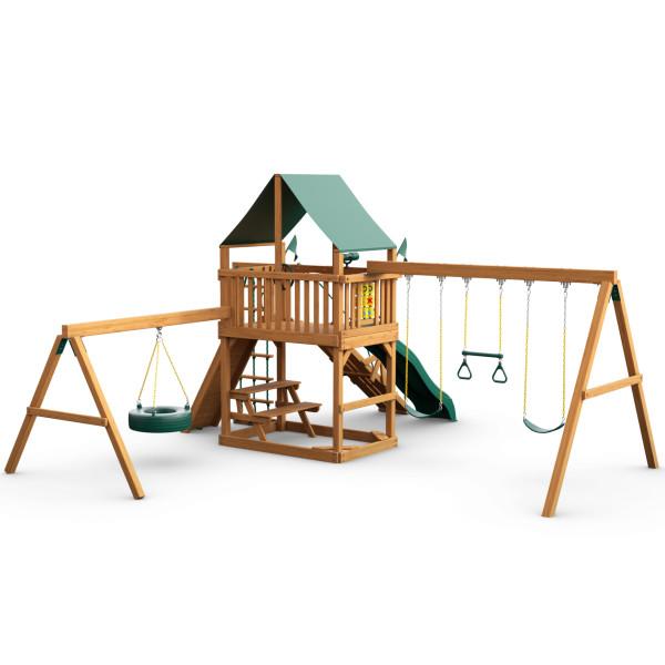 Wooden playset with green vinyl canopy, climbing ramp, Alpine Wave slide, tire swing, belt swings, trapeze, and built-in picnic table