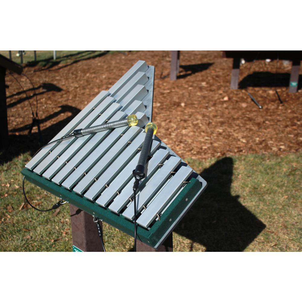 Merry Outdoor Musical Park Instrument freestanding green xylophone with metal bars and two mallets on playground grass and mulch surface